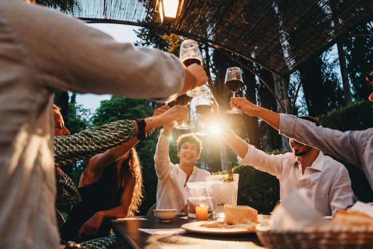 people eating outside at a restaurant 