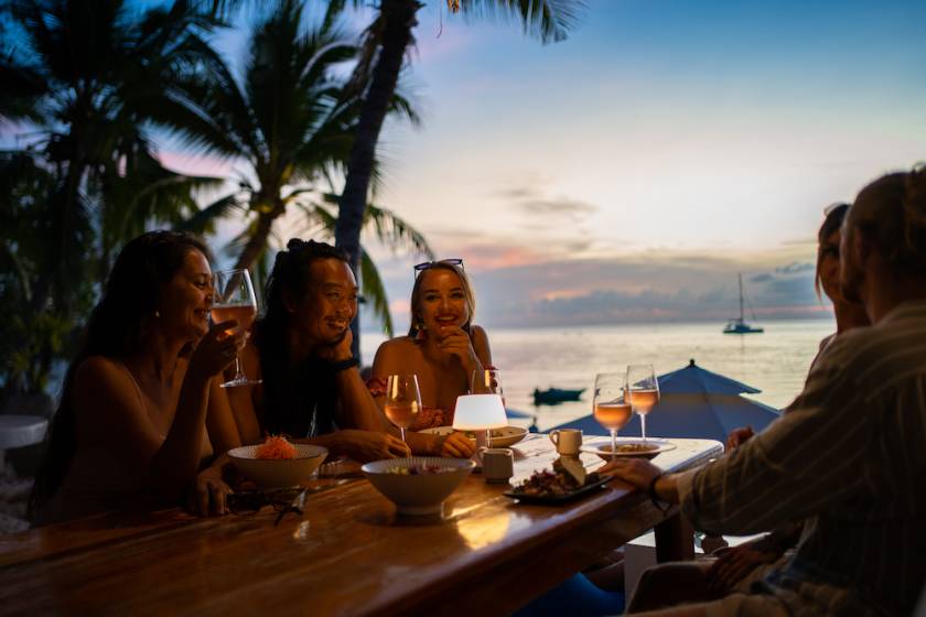 friends at dinner at beach