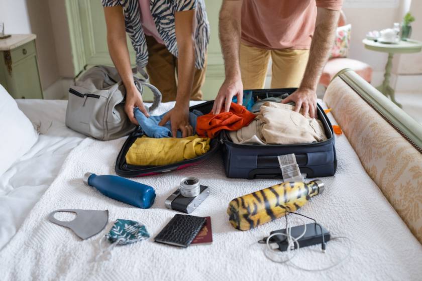 couple packing for vacation